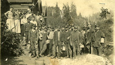 Miners at the turn of the century in front of the Henryville Mine (Later renamed Delmar Mine), approximately eight miles south of Coos Bay on the east bank of Isthmus Slough. Source: Coos History Museum and Maritime Collection, CHM 973-63d